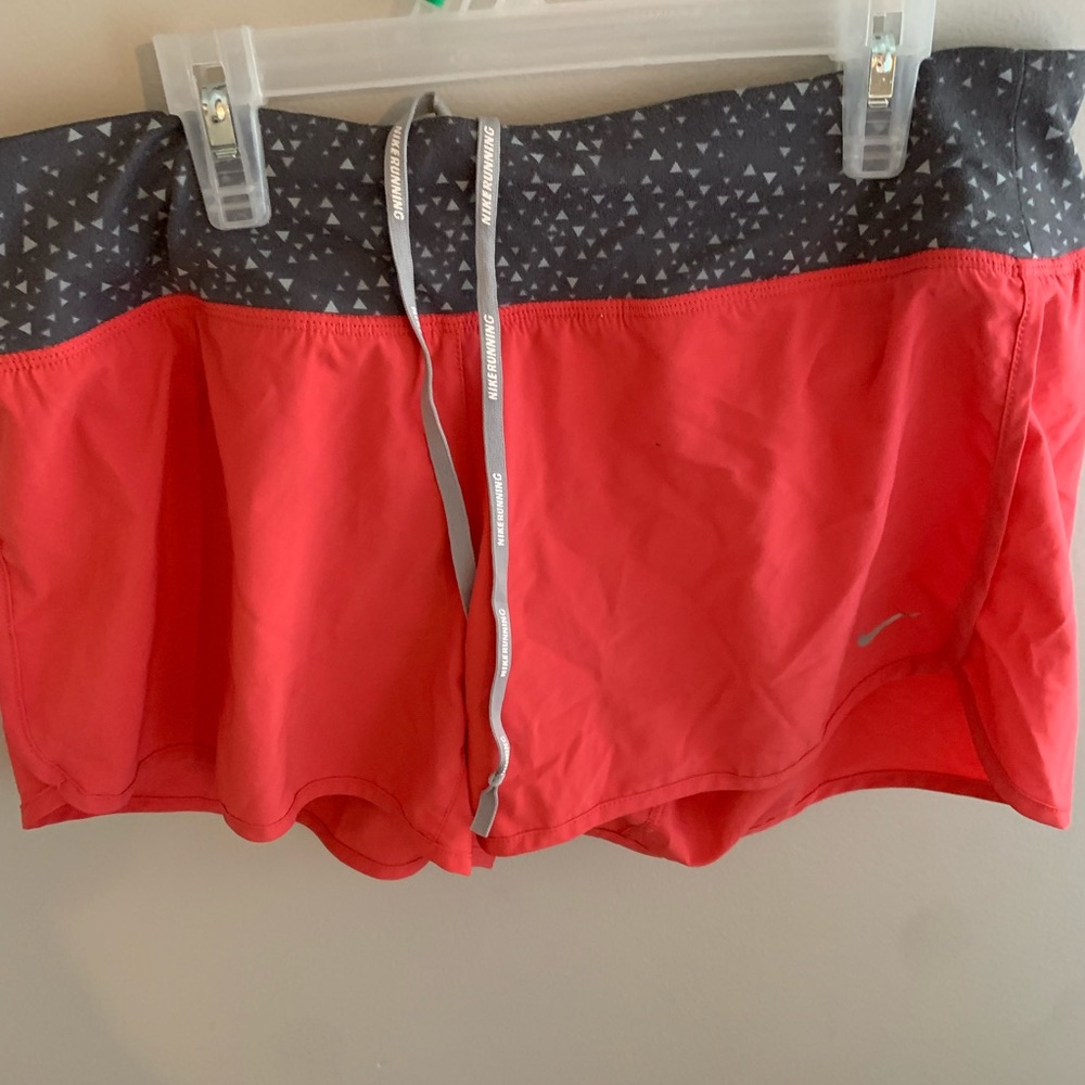 NIKE PINK SHORTS, SIZE MEDIUM.